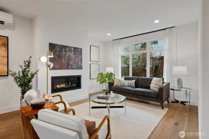 The large living room area has a gas fireplace and can be arranged in many ways, including a giant sectional or floating chairs and multiple sofas. The property just has one other custom home that faces the street- good privacy in the way the homes were designed.