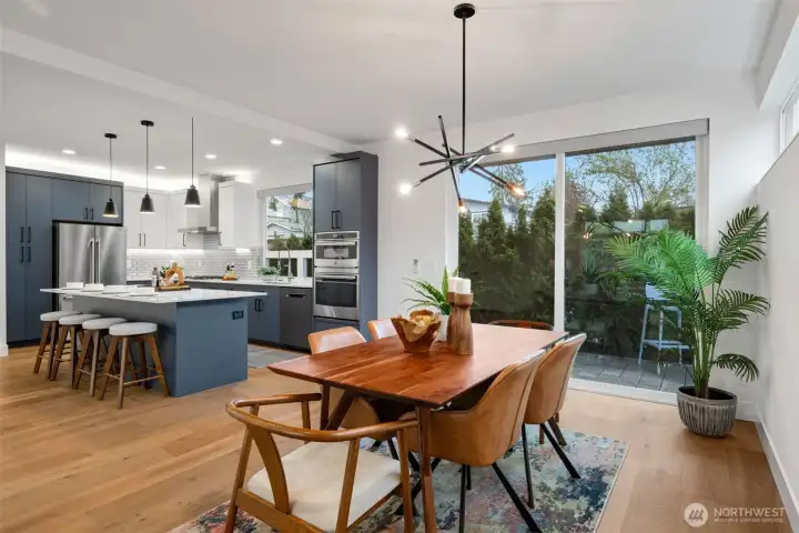 A private deck just outside the dining room and sliding doors. There are also Lutron remote blinds in both the kitchen window and the sliding doors.