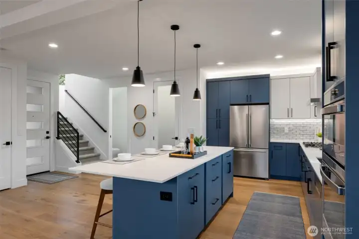 Entry, large coat closet, pantry and powder room.