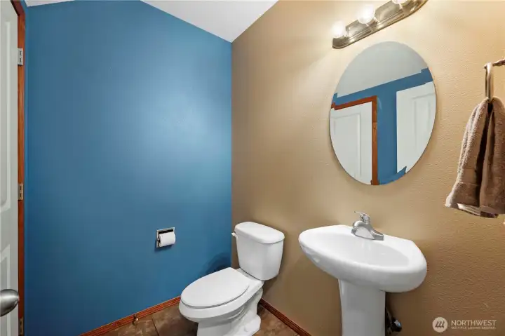 Main floor powder room with ample closet storage