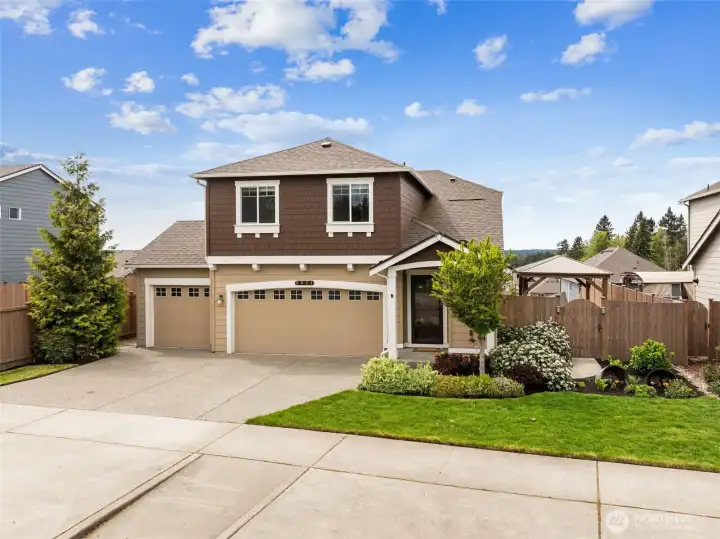 Welcome home! Rare 3-car garage on this 4 bedroom house with AC!