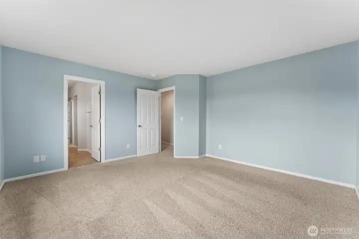 Primary bath with double vanities and extended shower.