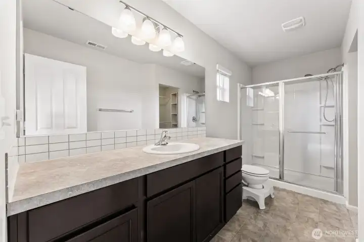 walk in closet with organizer.