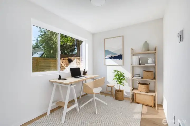 Virtually staged office or extra bedroom.