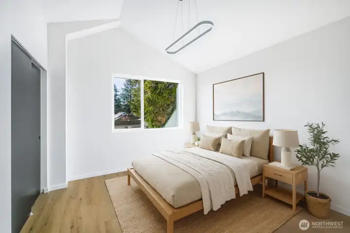 Virtually staged spacious primary en-suite with lofted ceilings