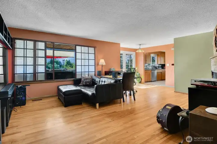 Just past the flagstone entry is the primary living space.  Original hardwood extends through all three bedrooms on the main level.