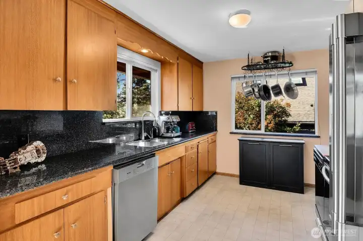 The spacious galley kitchen offers plenty of room for guests to congregate and collaborate on meals.