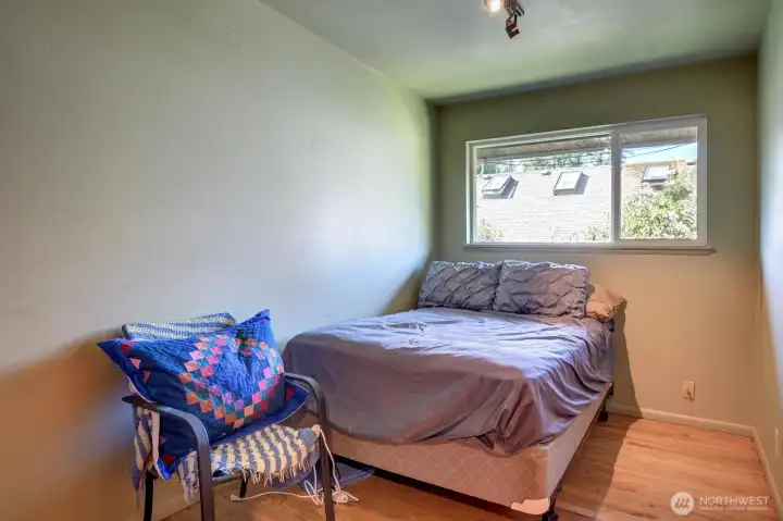 Another bedroom on the main floor. Not in the picture is a floor to ceiling built-in bookshelf with drawers.