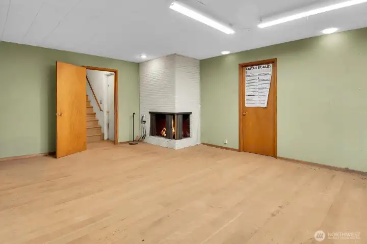 Downstairs you find another large living space with another wood burning fireplace.  Imagine it, and you will have room to make it happen here.  Home theater, game room, an oasis for the kids...