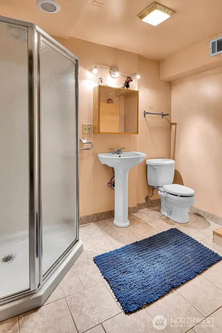 The all important second bath is a 3/4 located downstairs through the fourth bedroom.