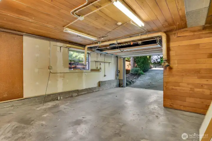 One car garage with plenty of room for a work bench.