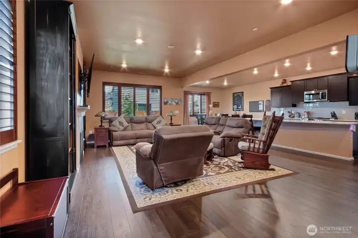 Great room is open to kitchen and dining space. High ceilings and abundance of lighting. Great room is open to kitchen and dining space. High ceilings and abundance of lighting.
