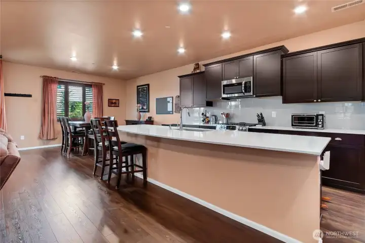 Massive quartz island and countertops. Plenty of room for dining and entertaining. Massive quartz island and countertops. Plenty of room for dining and entertaining.
