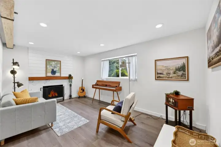 Bright & Spacious Lower-Level Family Room with Wood Burning Fireplace Bright & Spacious Lower-Level Family Room with Wood Burning Fireplace