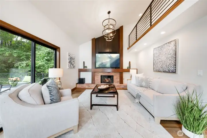 Another show-stopping space is the beautiful living room. The chandlelier and the loft share the limelight, what a place to entertain! Another show-stopping space is the beautiful living room. The chandlelier and the loft share the limelight, what a place to entertain!