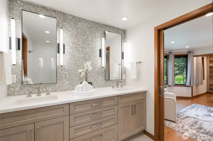 The primary bathroom with full tile backsplash and dual sinks, yes please! The primary bathroom with full tile backsplash and dual sinks, yes please!