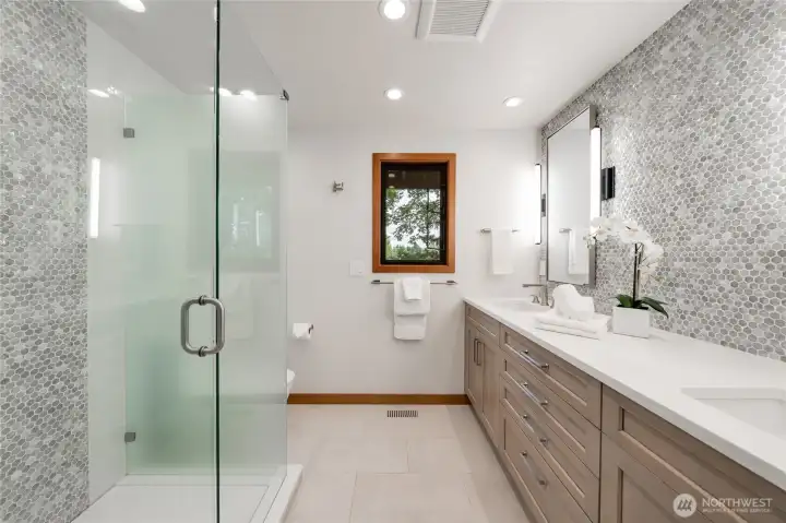 The frameless glass shower with rain shower head and stunning tile will surely impress. The frameless glass shower with rain shower head and stunning tile will surely impress.