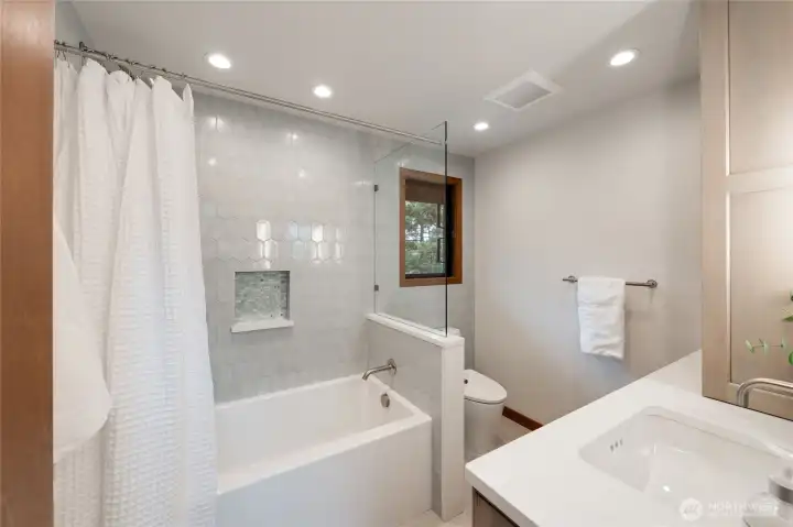 The upstairs hall bathroom with an extra deep soaking tub, gorgeous tile and loads of storage. The upstairs hall bathroom with an extra deep soaking tub, gorgeous tile and loads of storage.