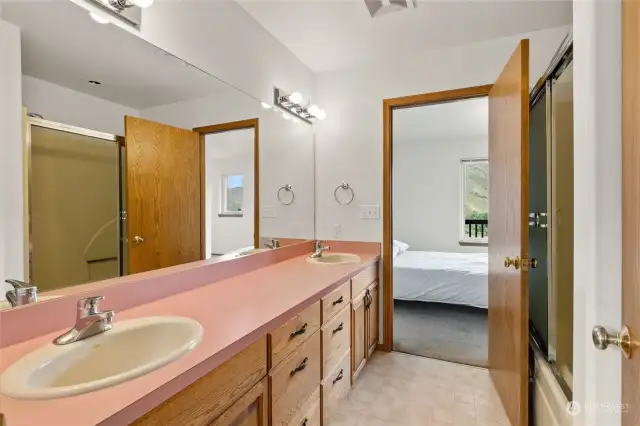 Jack and Jill bathroom, double vanity, full shower and tub with under cabinet storage for all the necessities.