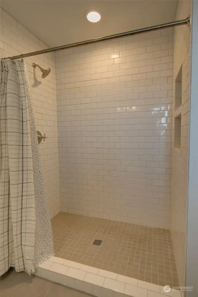 Step in shower in primary bathroom.