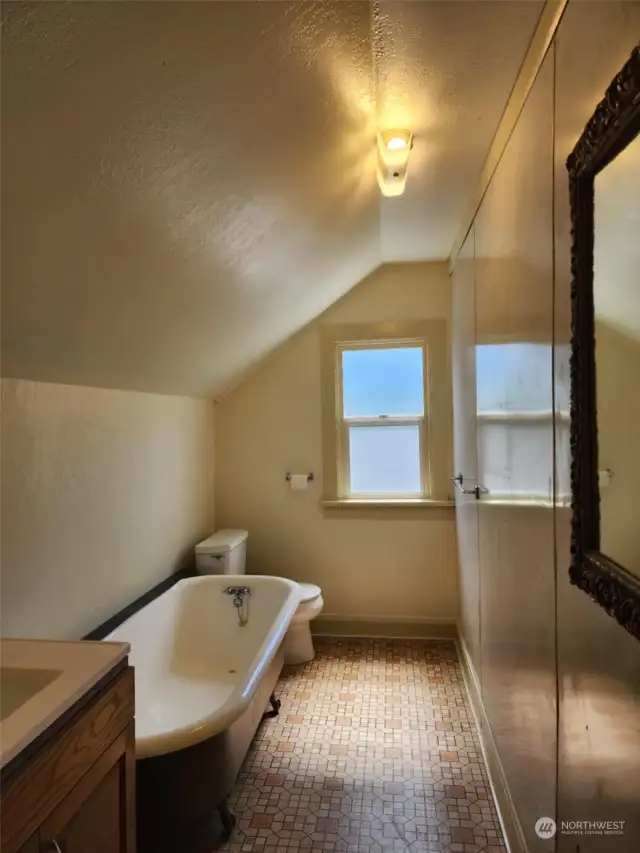 upstairs bathroom with claw foot tub