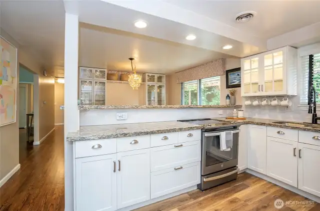 The kitchen opens seamlessly to the dining area, making entertaining effortless and enjoyable.