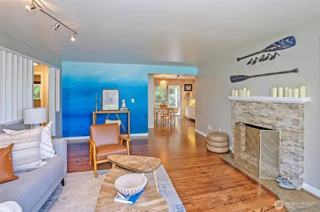 As you step through the front door, you’re immediately drawn to the beautifully refinished hardwood floors that extend through the home.