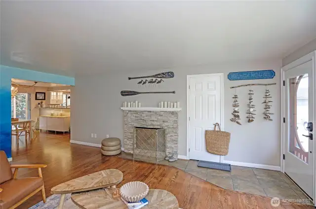 The wood-burning fireplace adds warmth and charm to the home’s inviting ambiance.