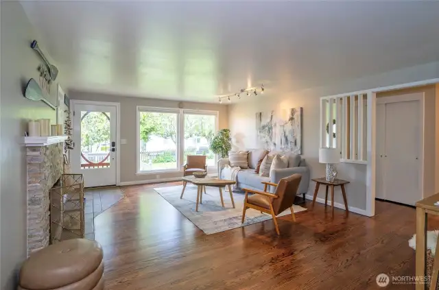 The dining area offers a wonderful view into the open and light-filled living room, creating a seamless and airy feel.