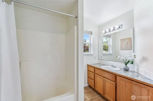 Guest bathroom upstairs is light and airy.