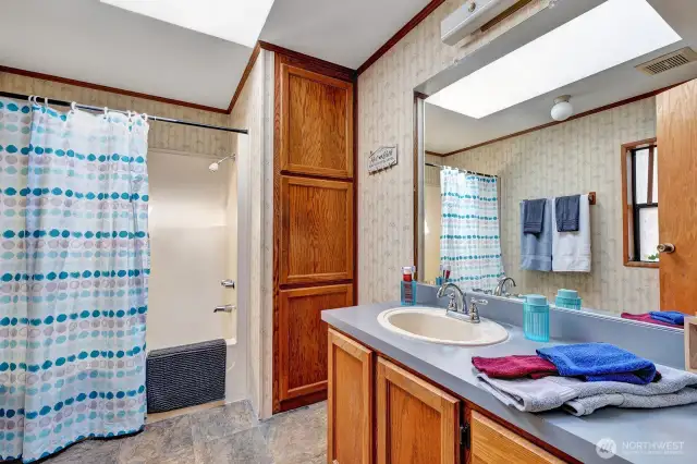 Private 3 pierce bath in the primary suite. Storage for all linens and bath necessities. Easy access for walker or wheelchair.