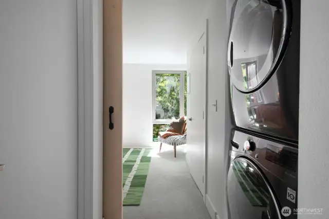 In-unit laundry tucked near the bedroom.