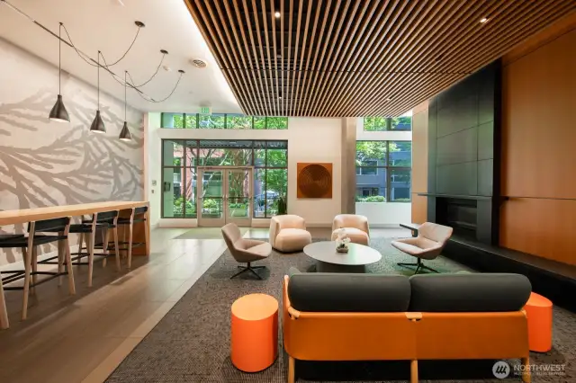 Beautifully designed resident lounge with cozy seating, modern design, and natural light throughout.