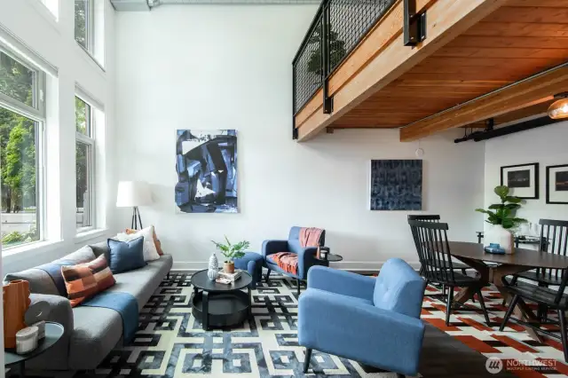 Soaring ceilings and exposed wood beams create a warm, open feel.