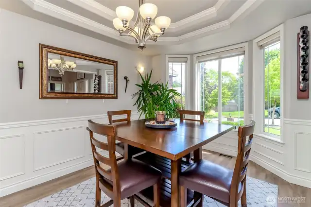 Dinning Room with Coffered ceilings and wanscoting