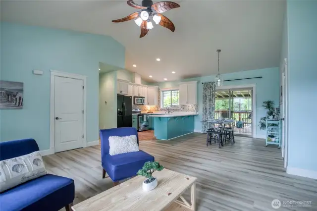 Open to kitchen and dining area