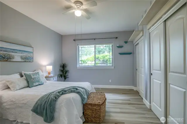 Primary bedroom with view of private back patio