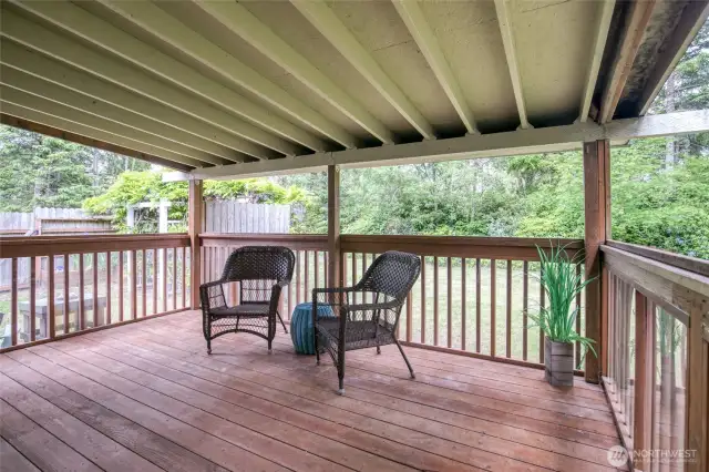 Covered back deck with room for BBQ and outdoor dining
