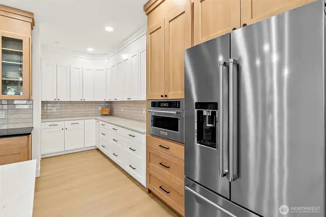 Custom two-toned maple kitchen cabinet package.