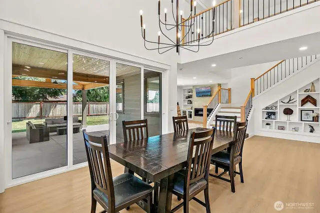 Two story dining area with double sliding doors.
