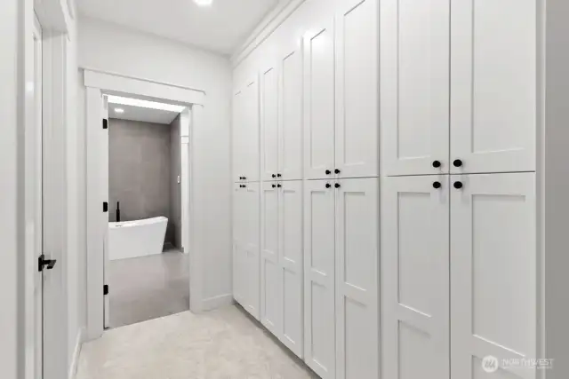 Additional storage cabinetry and finished room in primay suite.
