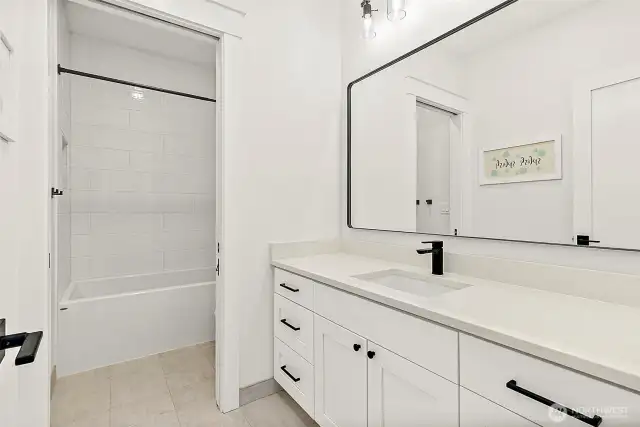 Upstairs bath with separate shower/toilet.