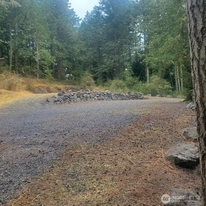 View from edge of lot near pump house towards driveway.
