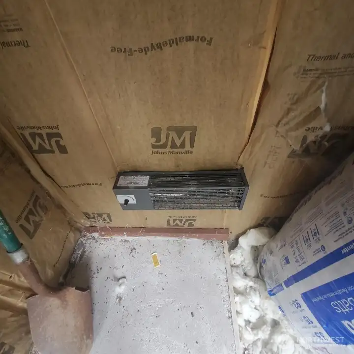 Hard-wired wall heater installed in pump house on a therostat.