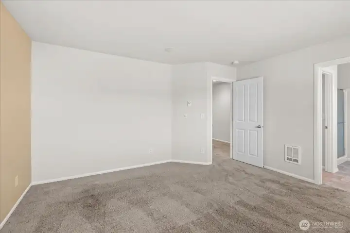 Another view of the primary bedroom
