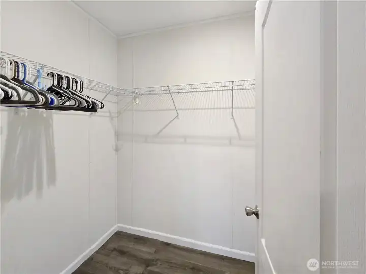 Walk in closet primary bedroom