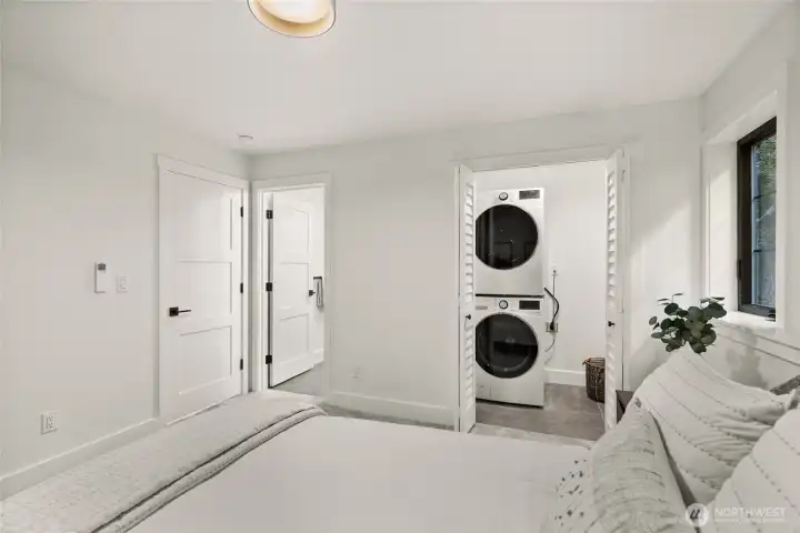ADU bedroom with bathroom and own laundry set up.