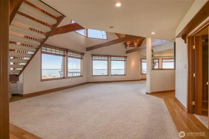 ENTERING THE HOME THROUGH THE FRONT DOORWAY INTO THE GORGEOUS LIVING AREA!  THE FIRST THING YOU SEE IS THE BEAURIFUL VIEW OF THE BAY!