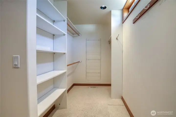 HIDDEN IN THE BACK OF THE PRIMARY BATH IS A HUGE WALK-IN CLOSET!
