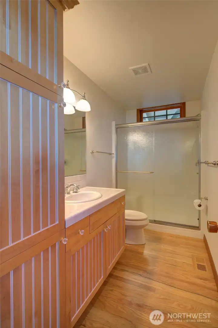 THE VISITOR'S 3/4 BATH IS JUST OFF THE LIVING AREA!  IT ALSO BOASTS A STEP-IN SHOWER!